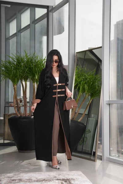 Black abaya with a leather belt in the front The cloth is crepe Free size C:2063
